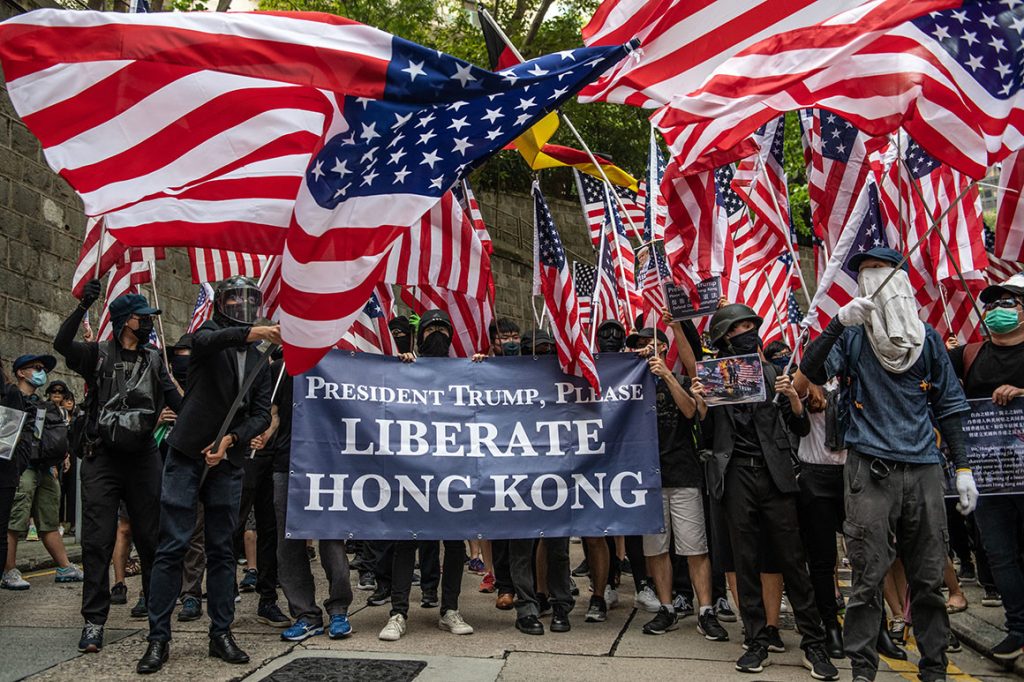 Anti-government protestors on the streets of Hong Kong carrying the American flag on Oct. 14, 2019. Photo- politco.com