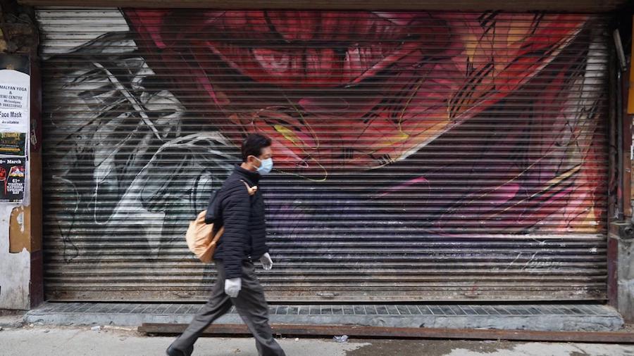 A man walks the deserted streets of McLeod Ganj. April 2020. Phayul photo-Tenzin Leckphel