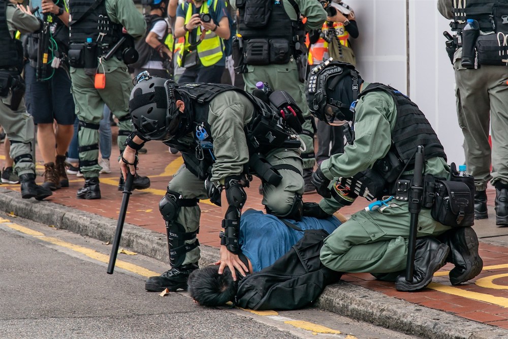 A pro-democracy protestor detained by the police in Hong Kong (Getty images)