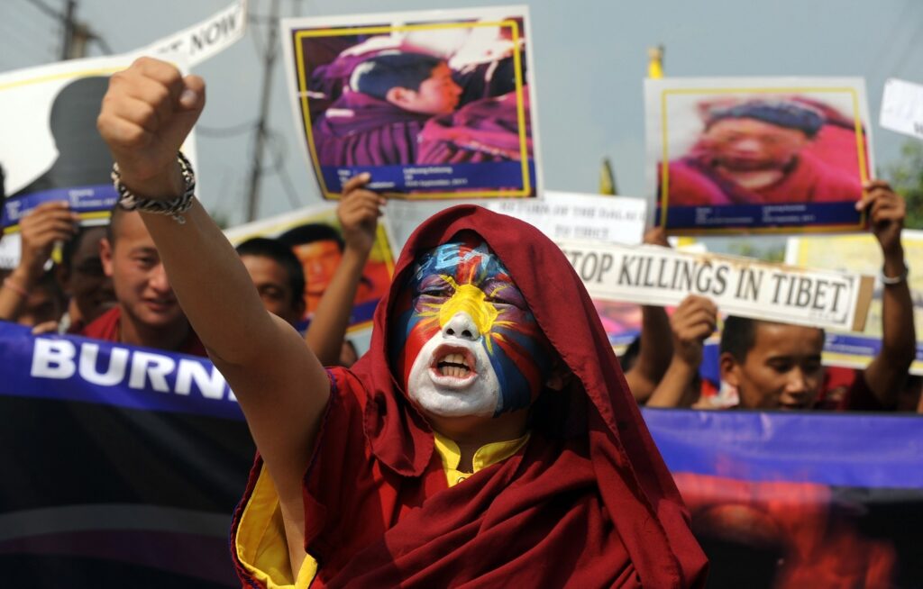 Tibetan monks during a protest rally in Siliguri on November 3, 2011. AFP PHOTO/Diptendu DUTTA