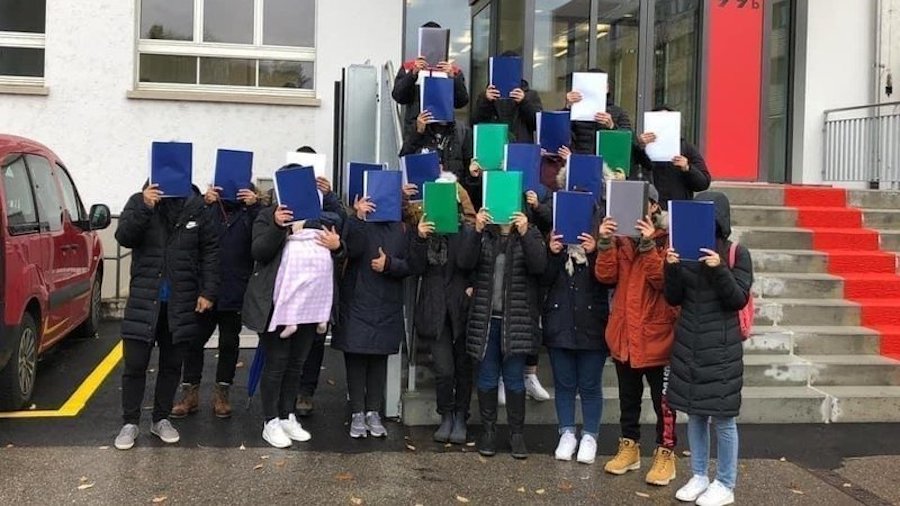 An undated photo of Tibetan asylum seekers in Switzerland infront of a government office ( photo-Legalization of Tibetans without Paper)