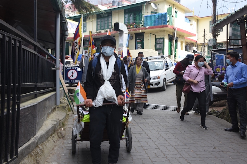 Tenzin Dhondup at Dolma square with activits following him in a show of solidarity on Monday (Phayul photo- Kunsang Gashon)