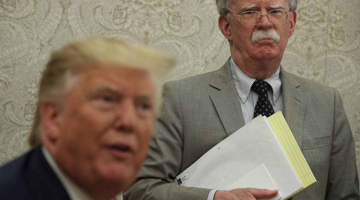 US President Donal Trump and his former NSA Advisor John Bolton (Photo courtesy Bloomberg)